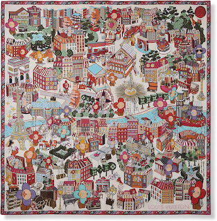 Illustrated overhead view of whimsical winter village with red and white buildings, churches, and snow