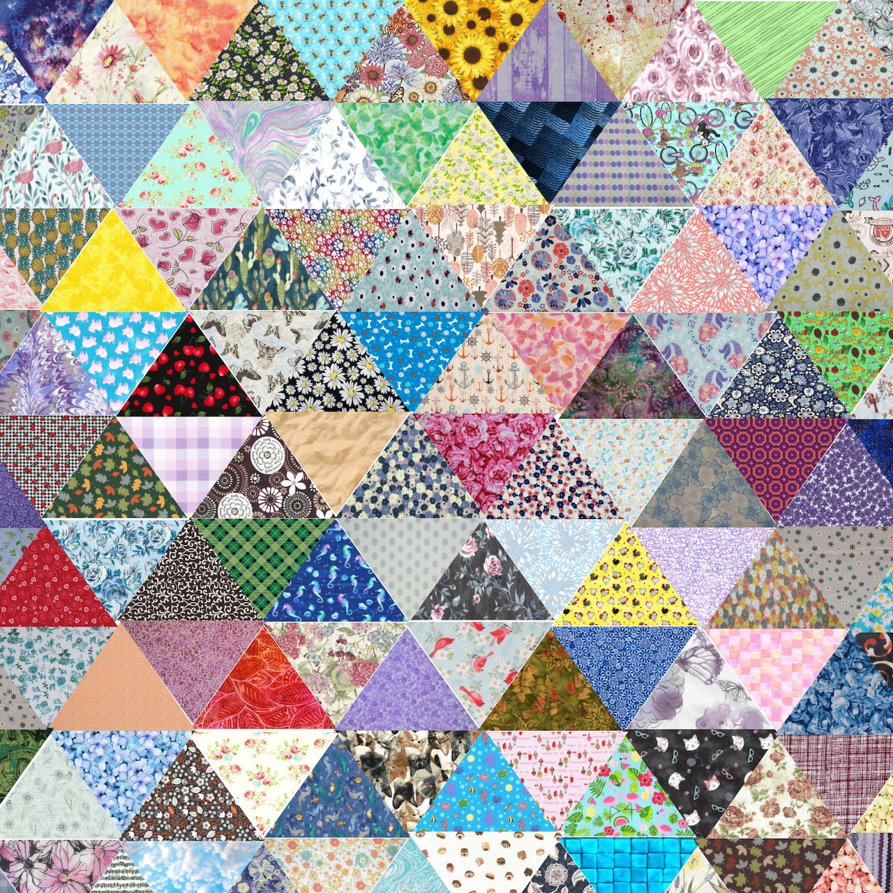 Colorful patchwork quilt made of triangular fabric pieces with various floral, geometric, and dotted patterns