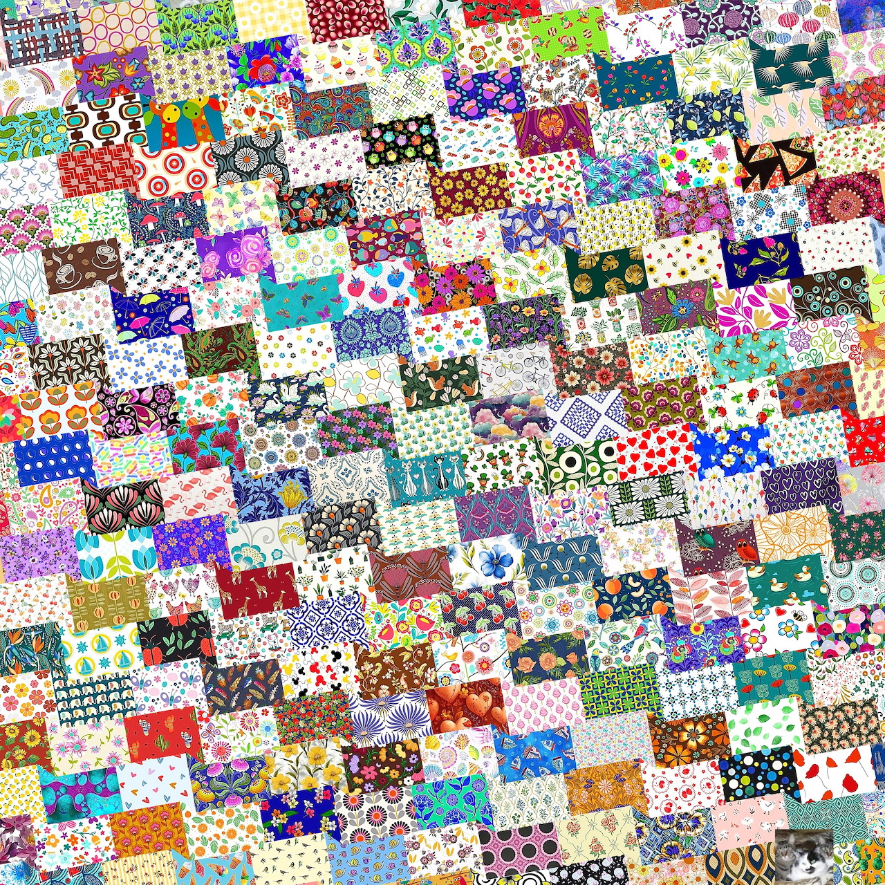Dense patchwork grid of colorful fabric squares with varied patterns and designs
