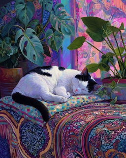 White cat with black markings sleeping on decorative cushions among tropical plants in a colorful room