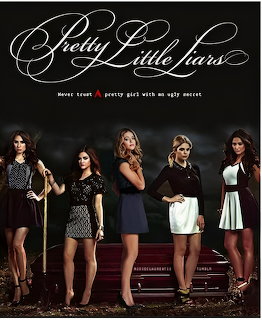 Five young women standing in a row posing in fashionable outfits against a dark background