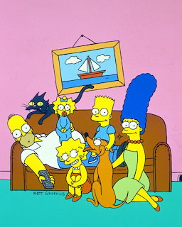 The Simpsons family sitting on their brown couch with pink background
