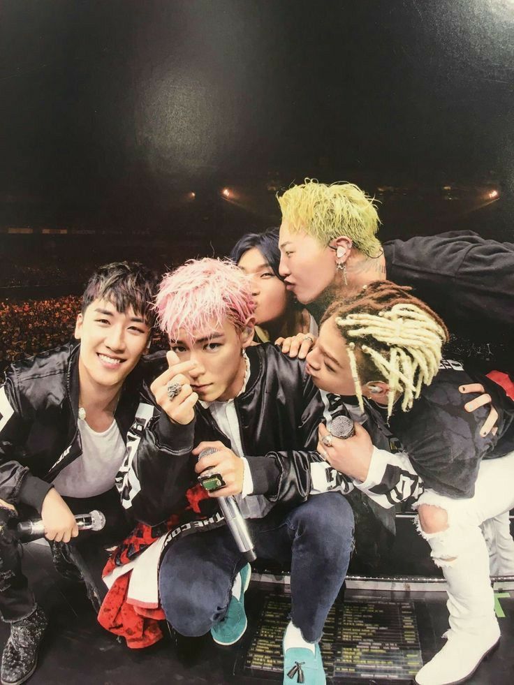 K-pop group BIGBANG members posing together in a stylish group portrait