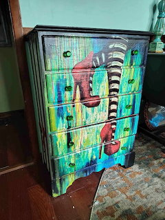 Hand-painted dresser featuring Wizard of Oz style striped legs and red shoes