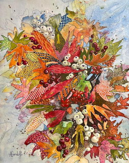 Colorful autumn floral collage with layered leaves, flowers and patterned fabric in warm tones