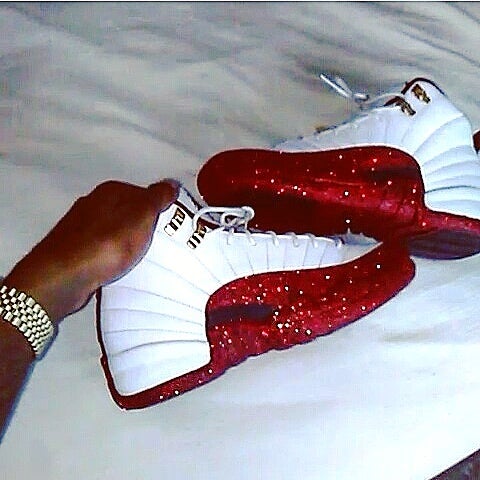 Pair of Air Jordan basketball sneakers shown together