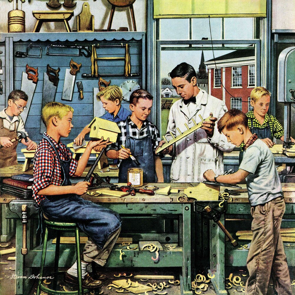 Children working on woodworking projects at a bench with tools while an instructor supervises in a workshop classroom