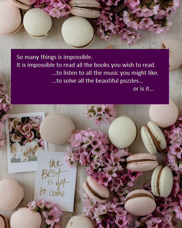Flatlay of pastel macarons with purple flowers and quote card on marble background