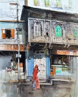 Watercolor painting of an ornate Indian street building with wooden balcony and a woman in an orange sari