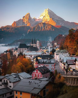 Berchtesgaden town in Bavaria, Germany with autumn trees and Watzmann mountain at sunrise