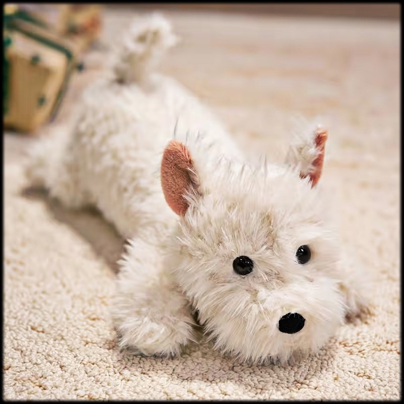 Fluffy white West Highland white terrier toy lying on a beige carpet