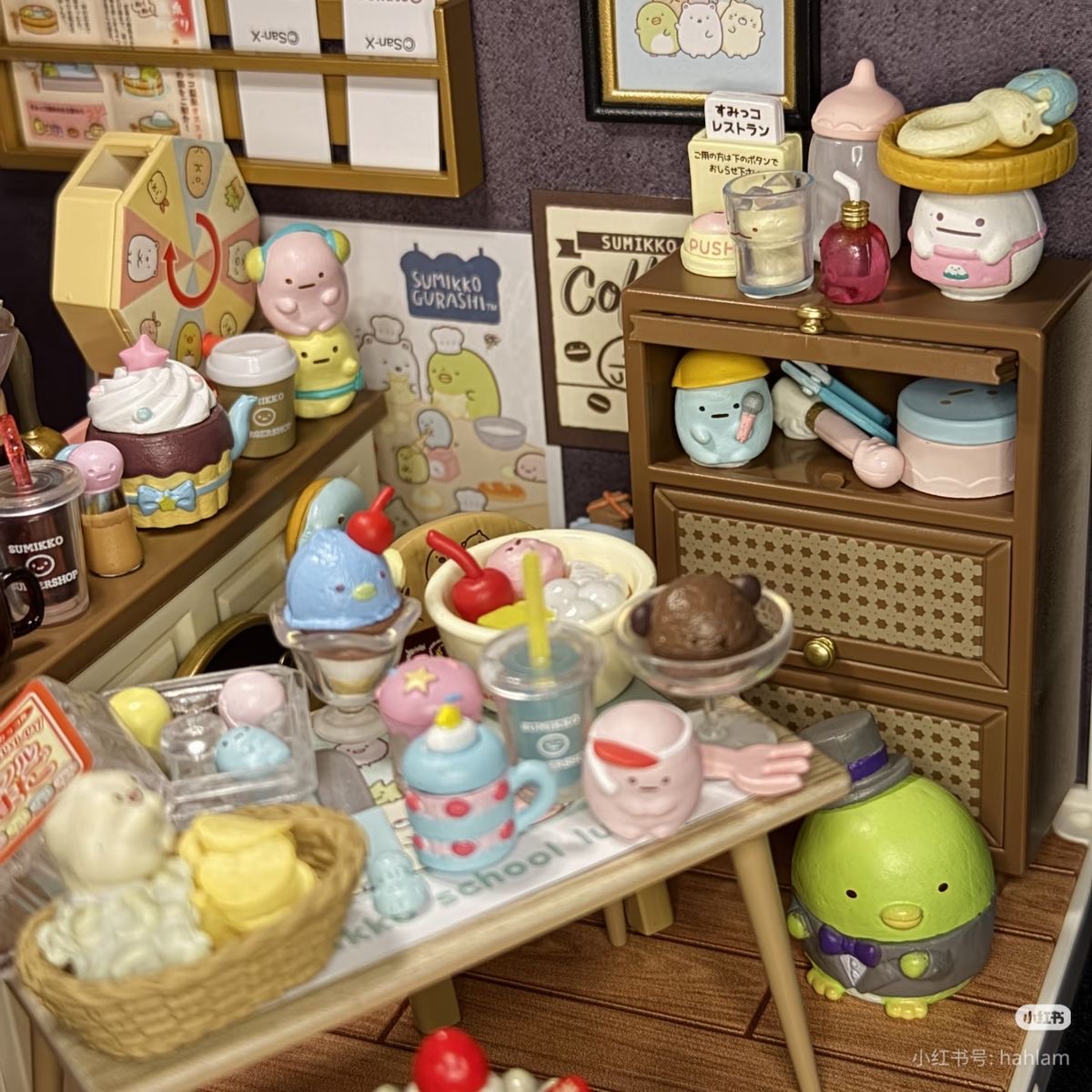 Miniature dessert shop with tiny cakes, pastries, shelves, and cute character decorations