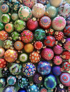 Densely packed colorful hand-painted German Christmas ornaments with intricate patterns and dots