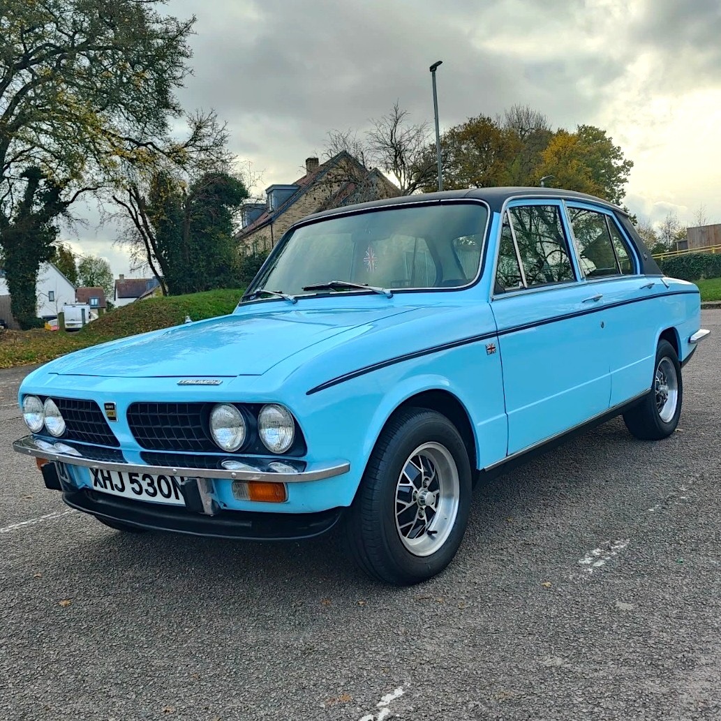 Light blue Triumph Dolomite Sprint classic car parked on a road outdoors