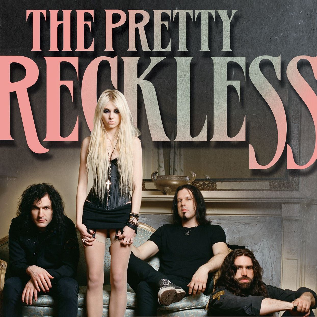 The Pretty Reckless band members in promotional photo with band name text