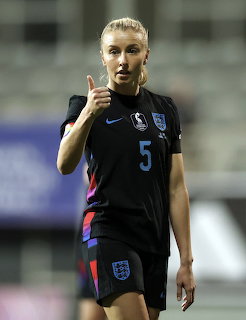Footballer in sports attire posing for a portrait