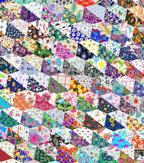 Dense patchwork quilt made of colorful triangle fabric pieces in various patterns and designs