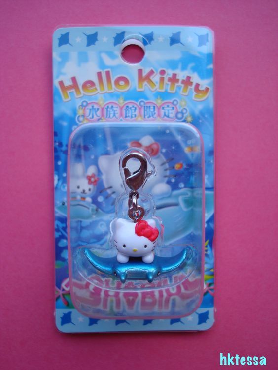 Hello Kitty charm keychain on retail card packaging with blue decorative design