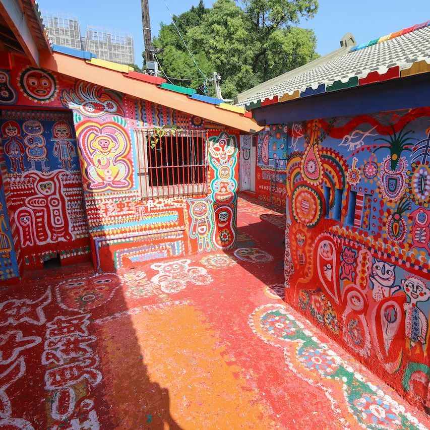 Brightly painted buildings and walkway covered in colorful folk art patterns at Rainbow Village, Taichung