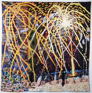 Abstract fiber art quilt with gold streaming lines, dots, and geometric patterns on black background