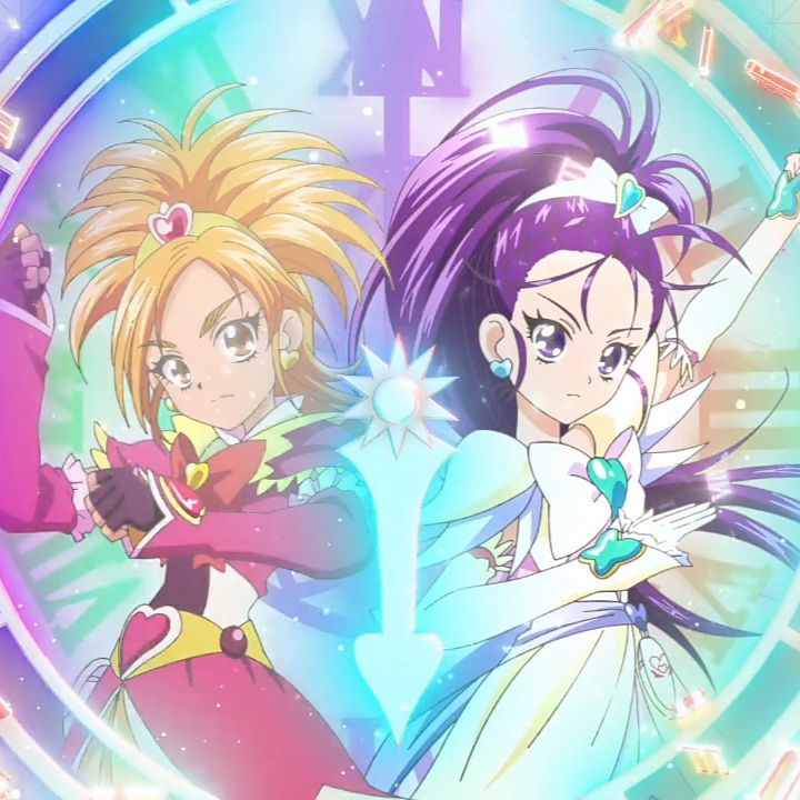 Anime magical girls Cure Bloom and Cure Egret posing in colorful costumes with pastel light effects