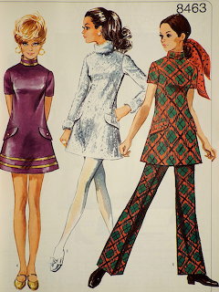 Vintage sewing pattern 8463 showing three women modeling mini dresses, a tunic, and a plaid pantsuit