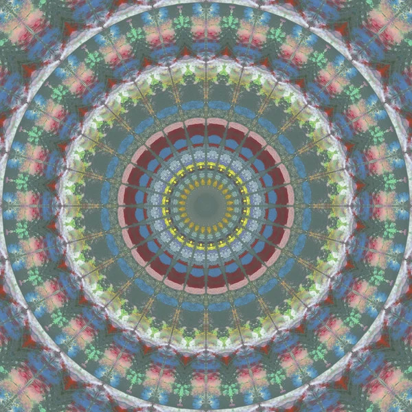 Detailed mandala with concentric circles in blue, red, yellow and green with symmetrical geometric patterns