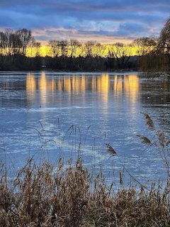 Winter Sunset Over Frozen Lake