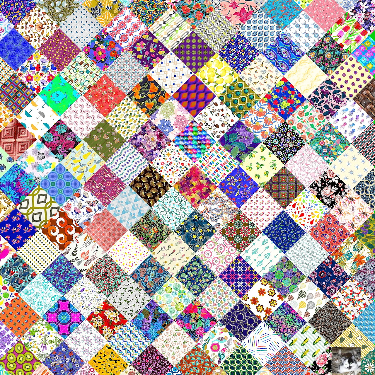 Colorful patchwork quilt with diverse fabric patterns in diamond grid arrangement