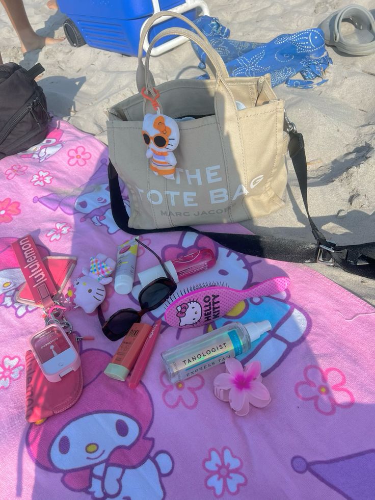 Hello Kitty cartoon character on a sunny tropical beach with palm trees and ocean.