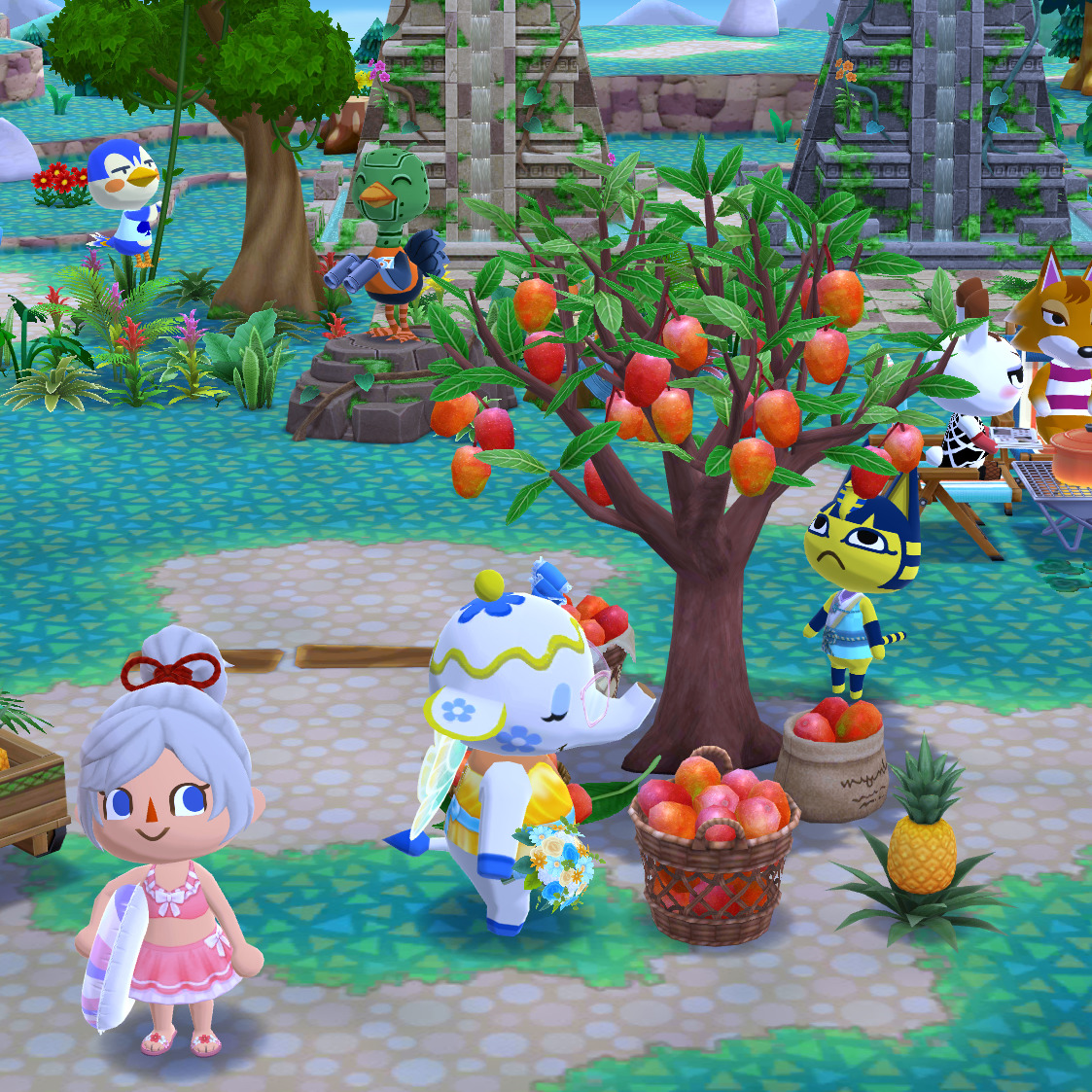 Cartoon village scene with three Animal Crossing characters near a fruit tree and baskets of fruit
