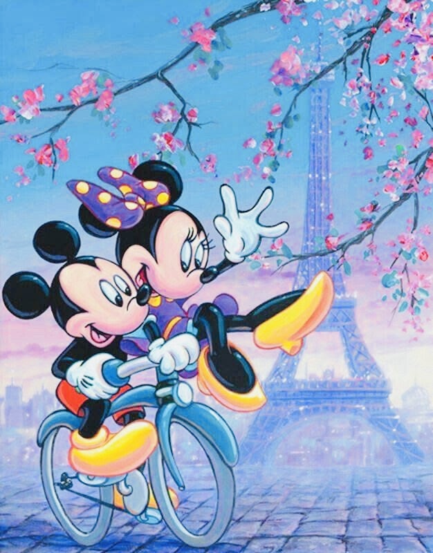 Mickey and Minnie Mouse riding a bicycle in Paris with the Eiffel Tower and pink blossoms