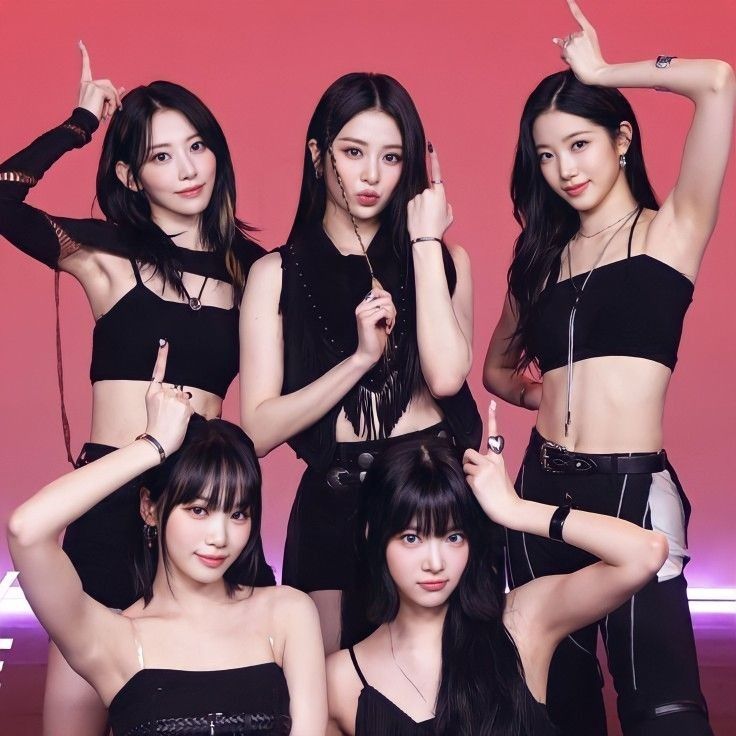 Five members of K-pop group Le Sserafim posing in black outfits on pink background