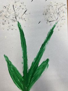 Hand-painted white flowers with green stems and leaves on white paper