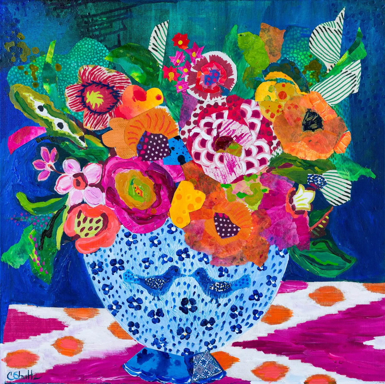 Colorful folk art flowers in ornate blue vase on polka dot surface