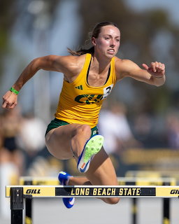 Woman Hurdler Track Competition
