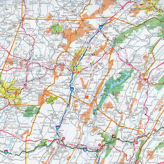 Colorful road map of central Pennsylvania with highways, towns, and terrain shading