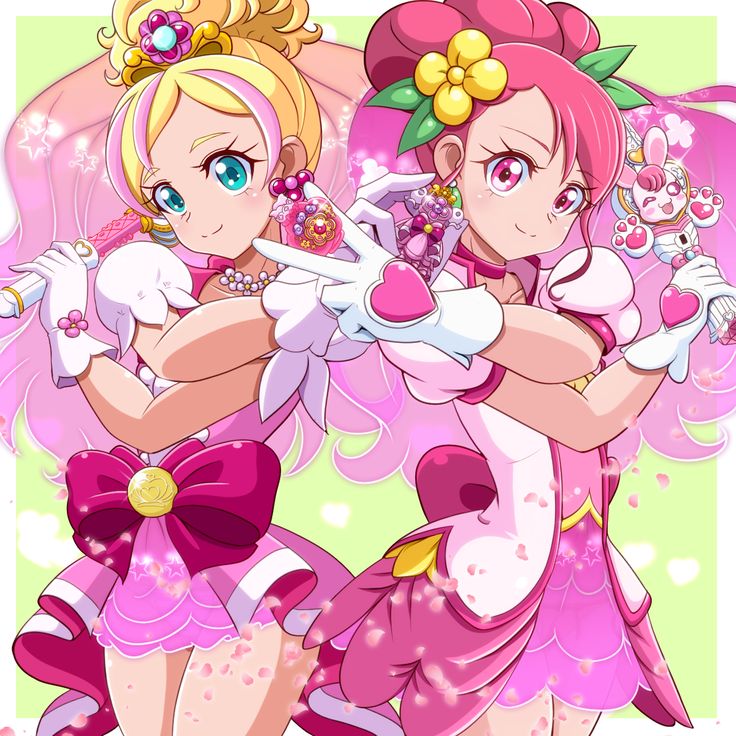 Two magical anime girls in pink costumes posing back to back with heart-themed accessories