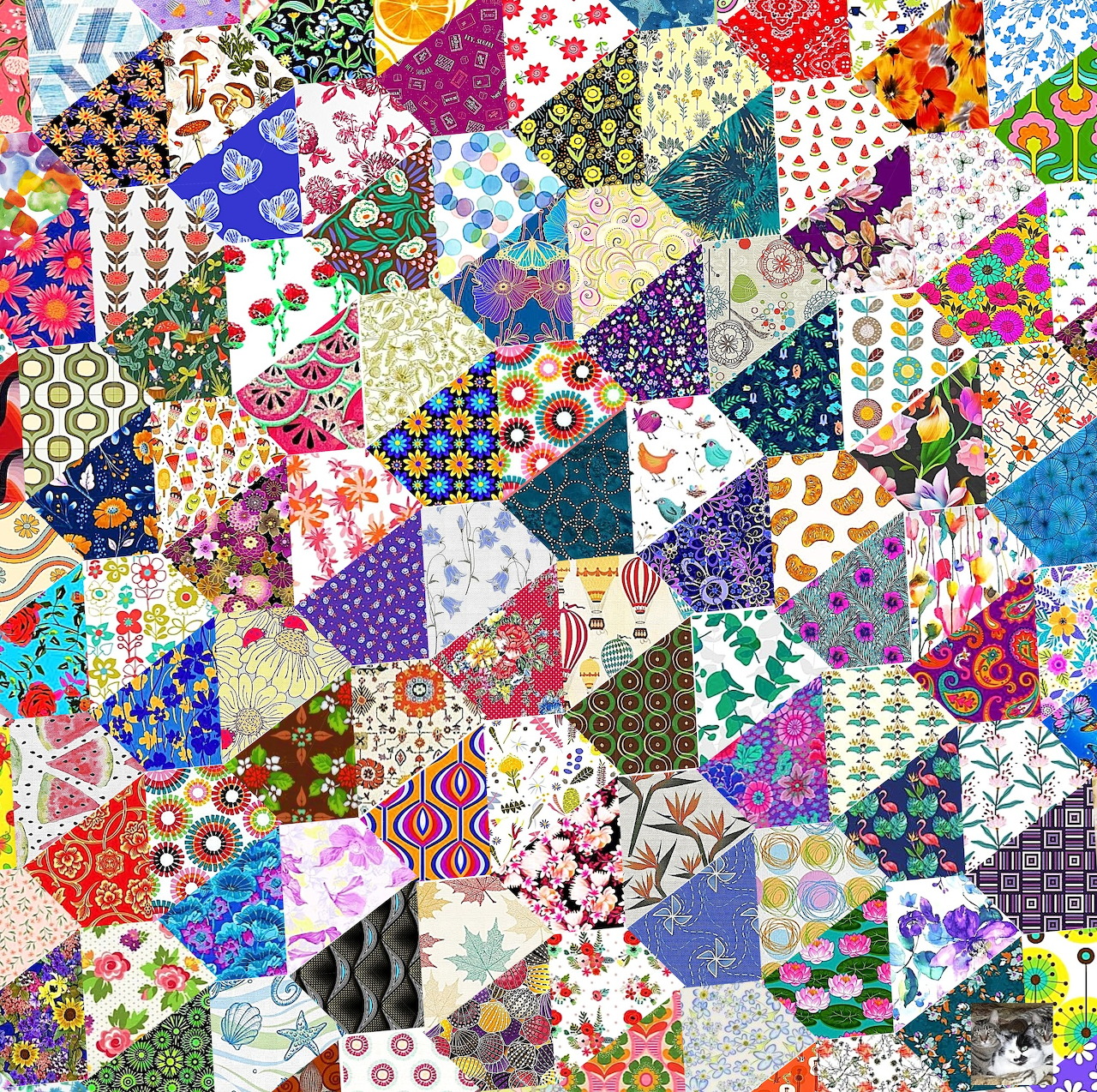 Colorful patchwork quilt with triangular fabric pieces in floral, geometric, and abstract patterns
