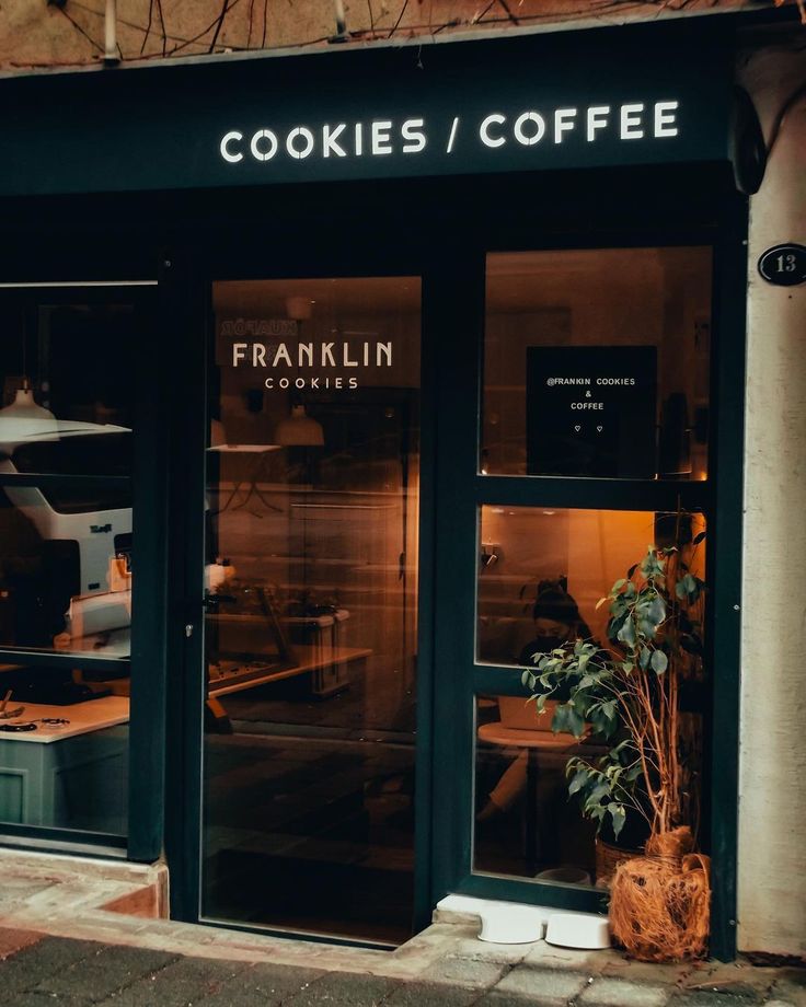 Stack of thick chocolate chip cookies on a cafe counter