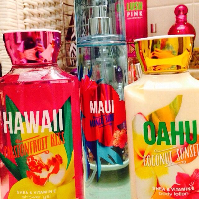 Colorful tropical fragrance bottles labeled Hawaii, Maui, and Oahu in a close-up display