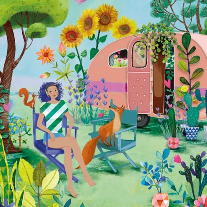 Woman sitting outside pink camper in lush garden with sunflowers and orange cat