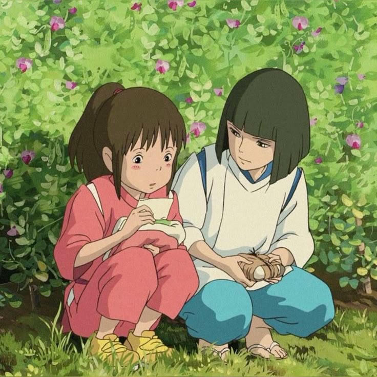 Two anime girls crouching in a grassy flower-filled garden