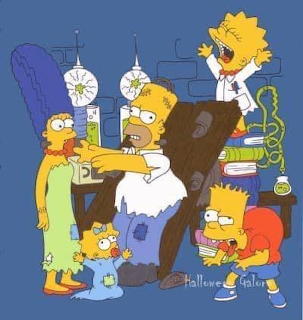 The Simpsons family in Halloween costumes posing together