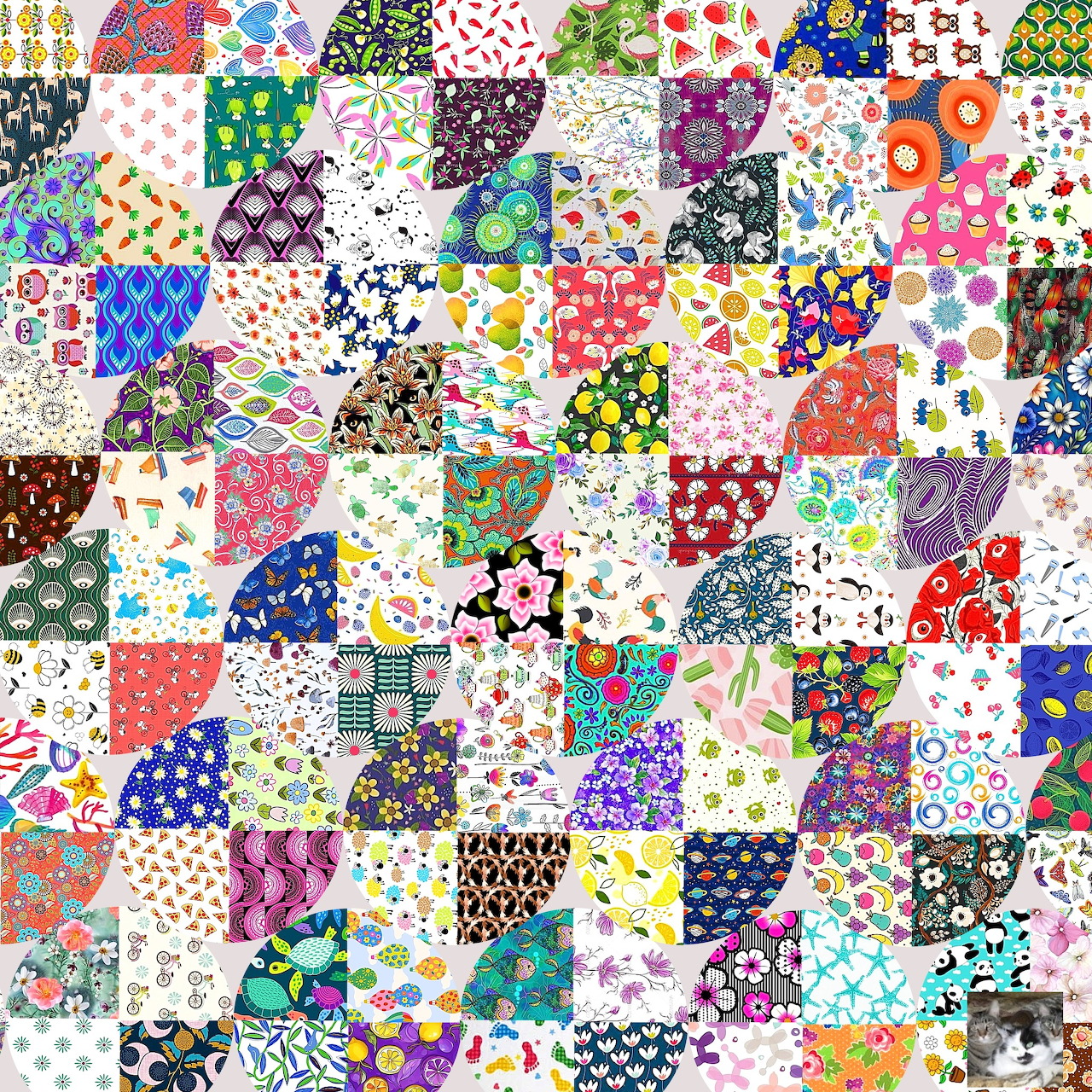 Colorful patchwork quilt with hexagonal fabric patches featuring various floral and geometric patterns