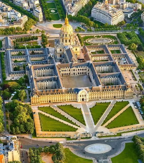 Aerial view of Les Invalides complex with golden dome and geometric gardens in Paris
