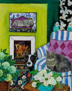 Gray cat and dog in colorful patterned living room with flowers, fireplace, and bold green wall