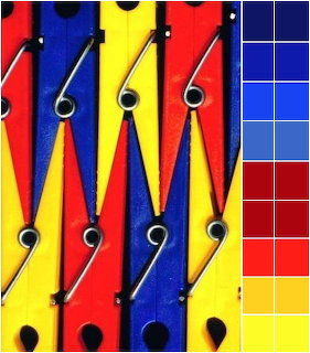 Colorful red, yellow, and blue clothespins in a row with color palette swatches on the right