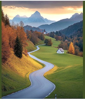 Winding road through green alpine valley with autumn trees, cottages, church, and mountain peaks at sunset