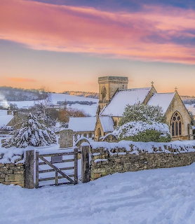 Snowy Village Church at Sunset